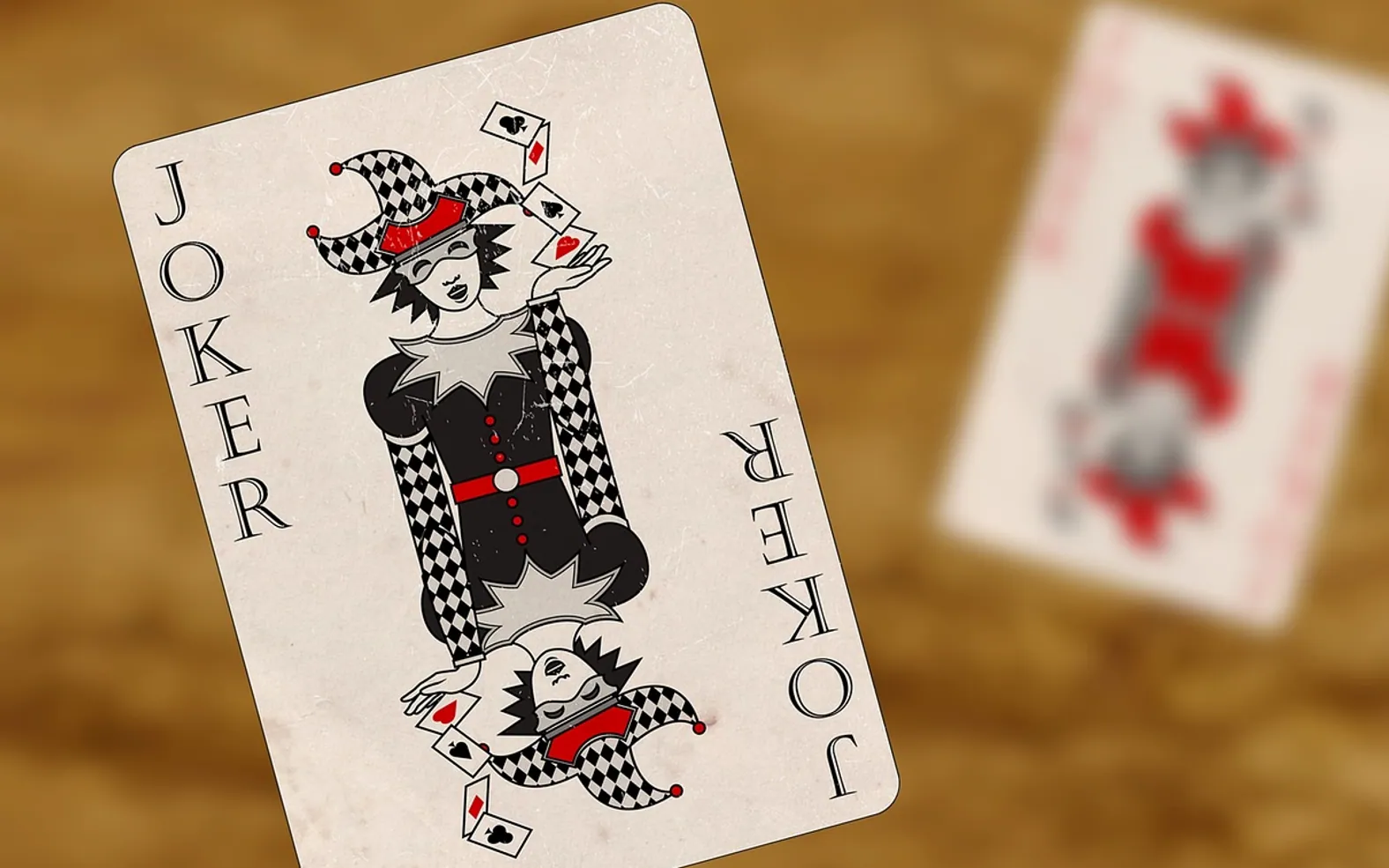 Playing cards, joker and red